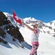 Girl on Diavolezza with Swiss Flag SLOW MOTION - VideoHive Item for Sale