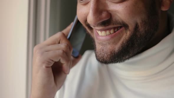 Closeup of Happy Guy Speaking on Phone