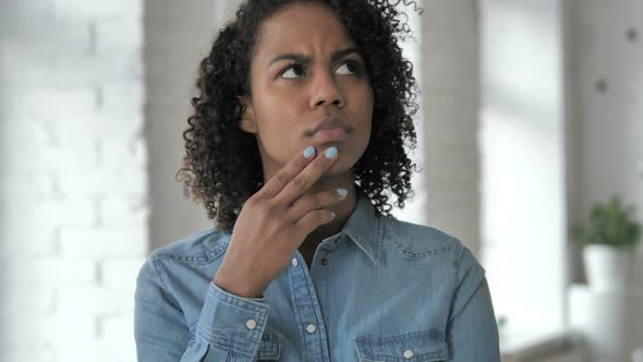 Thinking Pensive Young African Girl Brainstorming Idea