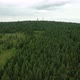 Fly over the forest, close to the trees, with the tower in the background, 4k drone. - VideoHive Item for Sale