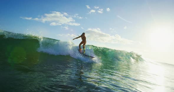 Young Woman Surfing at Susnet