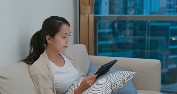 Woman look at the tablet computer at home