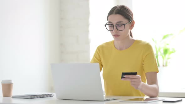 Woman making Successful Online Payment on Laptop