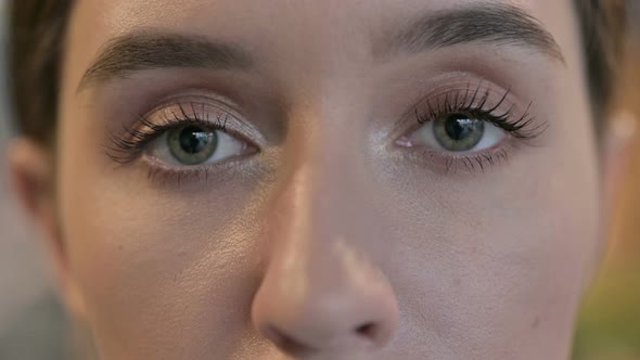 Close Up of Blinking Eyes of Young Woman