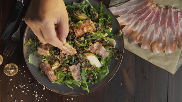 Flat Lay Shot: Chef Adds Roasted Slice of Bacon To the Vegetable Salad with Meat, Grilled Bacon