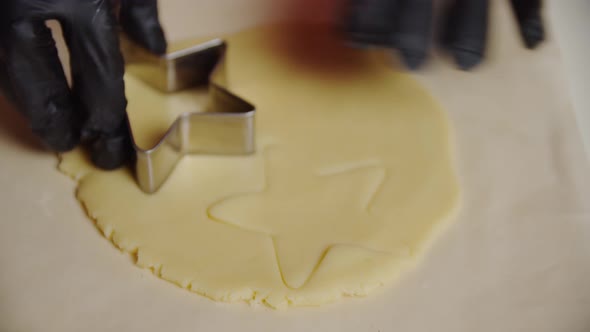 Close Up View of a Woman Hand Making a Gingerbread Cookie in the Form