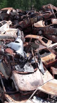 Vertical Video of a Dump of Cars Destroyed By the War in Ukraine