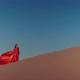 An Asian Woman in a Red Dress Dancing on Sand Dunes - VideoHive Item for Sale
