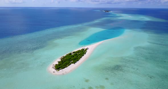 Wide overhead clean view of a paradise sunny white sand beach and blue ocean background in colourful