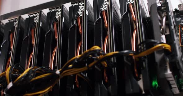 Video Cards in a Row Connected By Wires for Cryptocurrency Mining