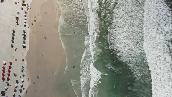 Aerial top down view of Praia Do Forte, Cabo Frio, Brazil during spring break