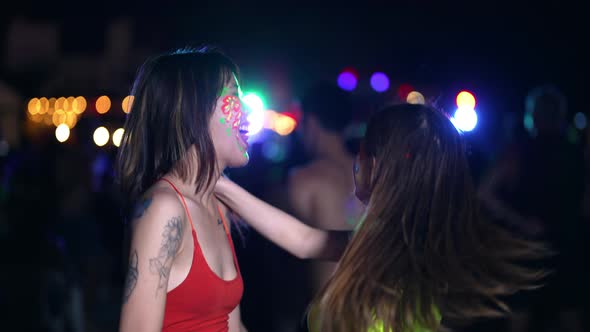 4K Group of Asian woman enjoy full moon beach party and dancing together.