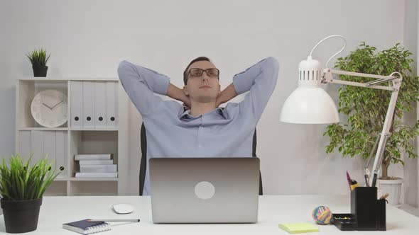 Creative Business Man Relaxing in the Office