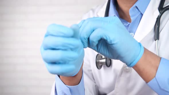 Doctor Wears Medical Latex Gloves Close Up