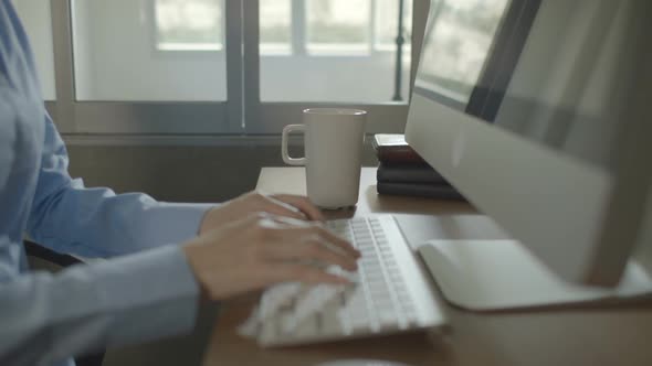 Woman Working With Computer In Morning