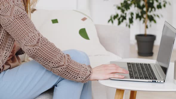 Cropped Shot Unrecognizable Woman Typing on Laptop Sitting at Home on Couch Works Online Holding