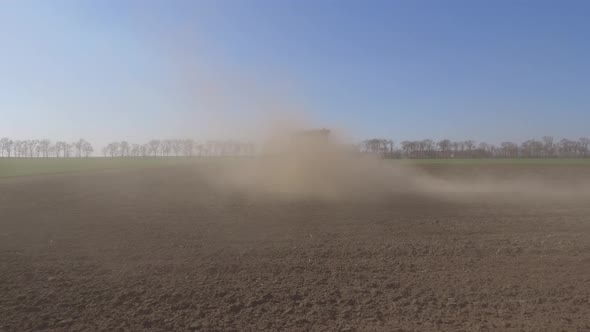 Tractor In A Cloud Of Dust