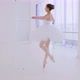 Ballerina in white tutu and pointes is spinning in dance in ballet class. - VideoHive Item for Sale