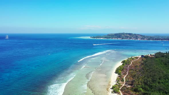 Aerial top down nature of tranquil bay beach lifestyle by blue ocean and white sand background of a 