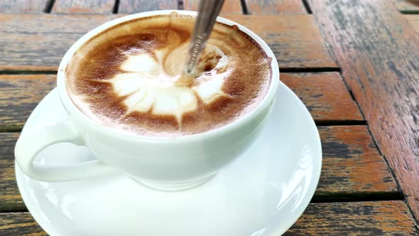 hot coffee on table / hot cappuccino with nice pattern milk foam 