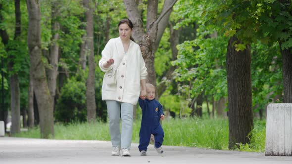 Mother and Child Walking in the Park in Summer Happy 1