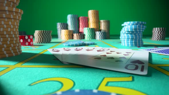 Camera Pans Over Gaming Table with Casino Chips Cards and Dice in Green Screen Chroma Key Background