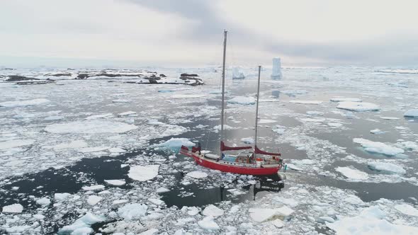 Sailing Yacht Sail in Arctic Dangerous Frozen Ocean