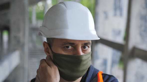 The Man Removes the Protective Mask From His Face To Symbolize the End of the Pandemic