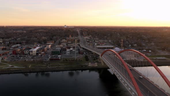 Crossing Mississippi River alongside Hastings Bridge. Aerial view at dusk.