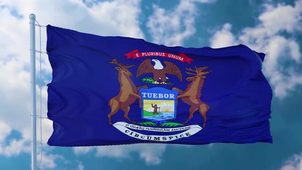Flag of Michigan Waving in the Wind Against Deep Beautiful Clouds Sky