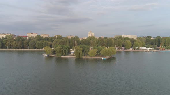 Aerial view of lake and trees near buildings