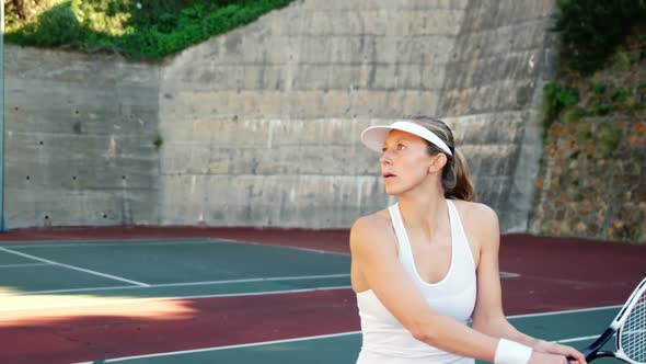 Active sportswoman playing tennis