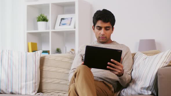 Indian Man with Tablet Pc Sitting on Sofa at Home 57