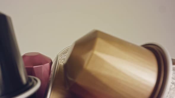 Macro shot of espresso capsules in various colors and flavors