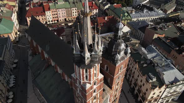 Aerial view of the St. Mary's church and the old city in the background during sunny day. Krakow, Po