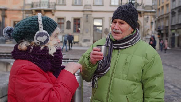 Senior Couple Tourists Grandmother Grandfather Drinking From Thermos Enjoying Hot Drink Tea Coffee