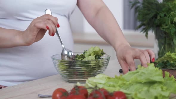 Healthy Diet Pregnant Woman Cook Salad with Fresh Vegetables and Herbs Closeup