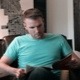 Man Casually Reading Magazine in Leather Chair - VideoHive Item for Sale