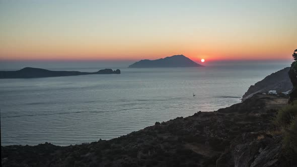 Golden Hour Sunset Time Lapse of Sun Disappears in Ocean of Greek Island Milos, Greece