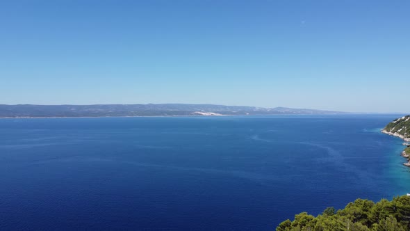 view towards the island of brac in Dalmatia (Croatia) on the breathtaking Adriatic Sea, the sun is s