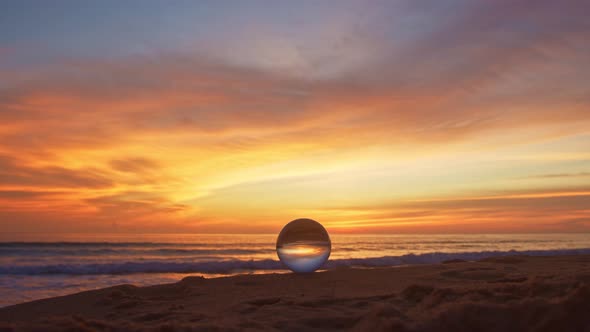Crystal Ball On The Beach At Sunset