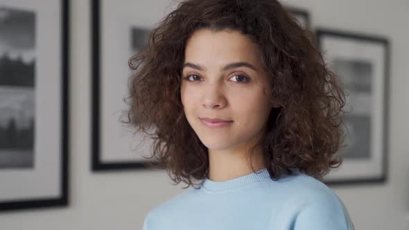 Smiling Cute Cheerful Young Pretty Hispanic Latin Woman Looking at Camera