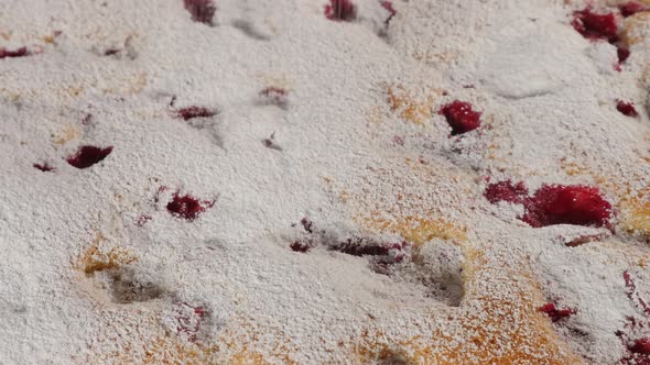 Powdered sugar dust adding on sour cherry cake close-up 4K 2160p UHD footage - Icing sugar dust on c