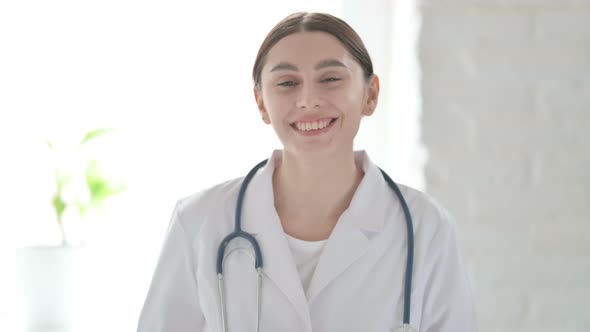 Portrait of Female Doctor Talking on Video Call