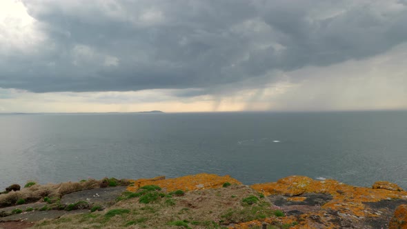 A time lapse of a weather system moving across the Ocean in Scotland on Handa Island. Moody clouds a