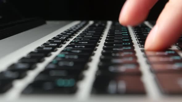 Hands of an Office Worker Typing on Keyboard, Close Up, Cam Moves To the Right, Side View, Black