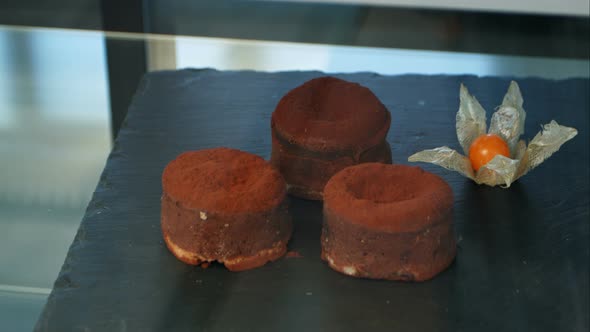 Chocolate Cakes on the Black Display of a Pastry Shop