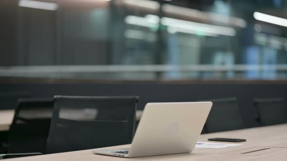 Woman Coming Back Opening Laptop at Work