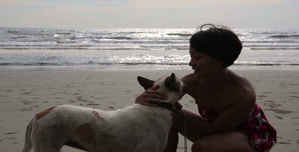 Woman Exercise Her Dog At Beach 1 alt