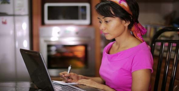 Woman Sitting With Laptop By Oven Kitchen 3